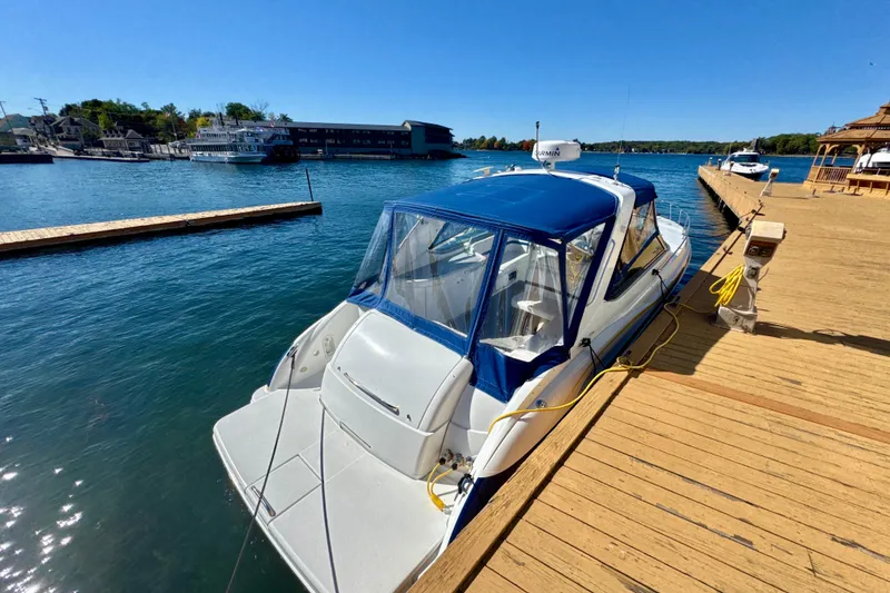 Slide: The Image of 2006 Formula 370 Super Sport boat docked at a sunny marina. - 2