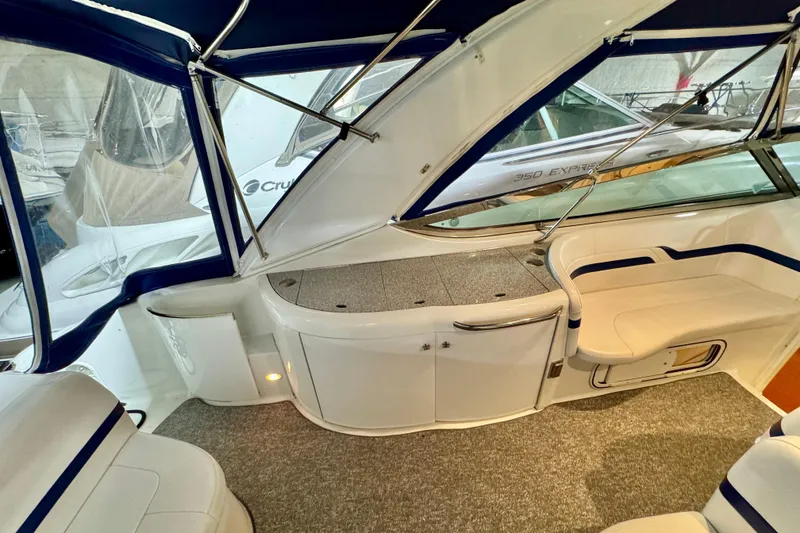 Slide: The Image of 2006 Formula 370 Super Sport boat interior with seating and storage. - 26