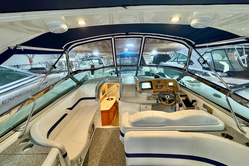 Slide: The Image of 2006 Formula 370 Super Sport boat interior with helm, seating, and navigation equipment. - 27