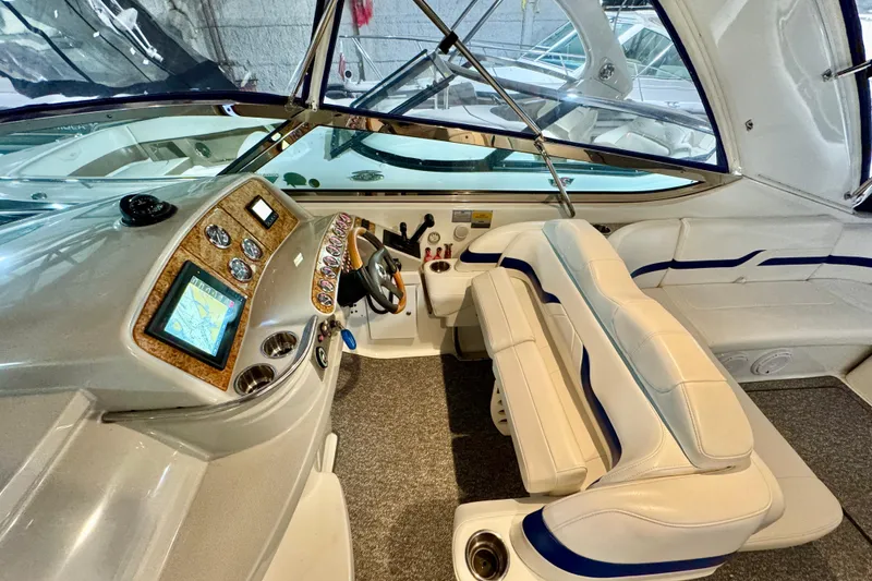 Slide: The Image of 2006 Formula 370 Super Sport boat interior with modern dashboard and plush seating. - 29