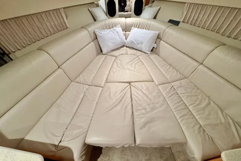 Slide: The Image of Luxurious interior of 2006 Formula 370 Super Sport with beige leather seating and pillows. - 35