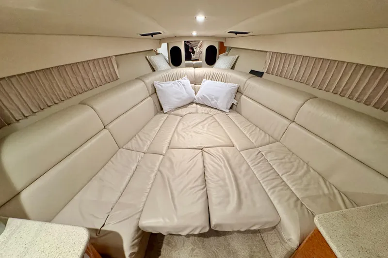 Slide: The Image of Interior cabin of 2006 Formula 370 Super Sport with beige leather seating and pillows. - 36