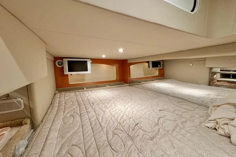 Slide: The Image of Interior cabin of 2006 Formula 370 Super Sport with cozy bedding and TV. - 42