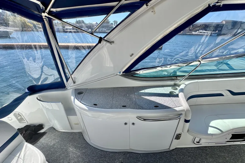 Slide: The Image of 2006 Formula 370 Super Sport boat interior with sleek seating and waterfront view. - 5
