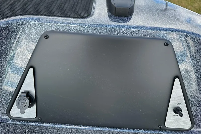 Slide: The Image of Control panel of 2026 Lund 189 Pro-V GL boat with 12V outlet and trim switch. - 15