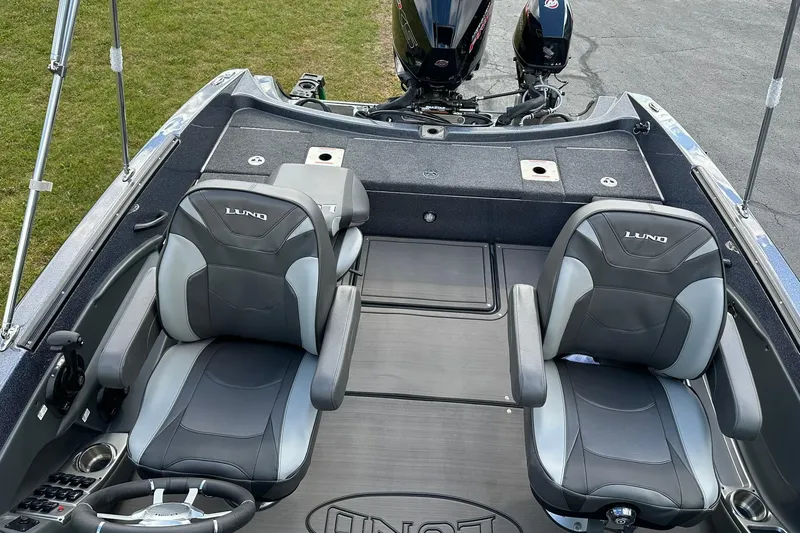 Slide: The Image of 2026 Lund 189 Pro-V GL boat interior with two seats and steering wheel. - 16