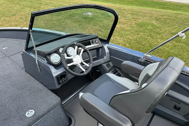 Slide: The Image of 2026 Lund 189 Pro-V GL boat interior with steering wheel and dashboard. - 17