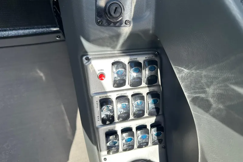 Slide: The Image of Control panel of 2026 Lund 189 Pro-V GL boat with labeled switches. - 21