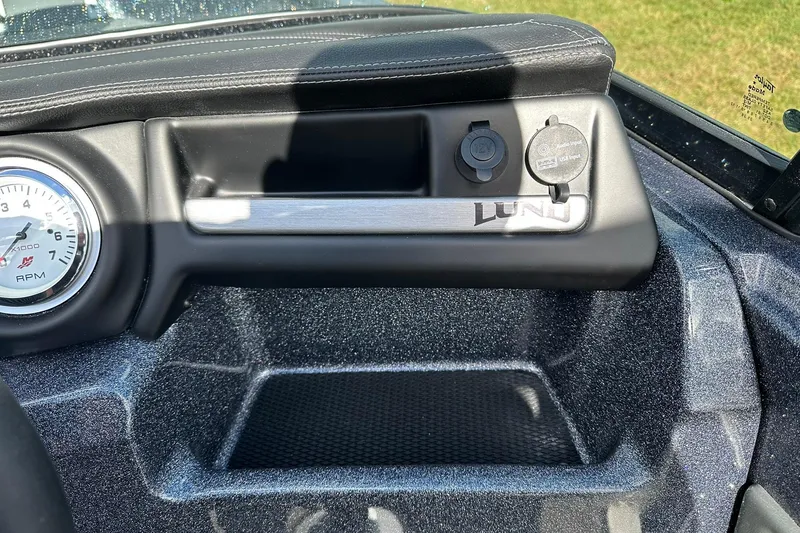 Slide: The Image of Dashboard of 2026 Lund 189 Pro-V GL boat with RPM gauge and USB port. - 22