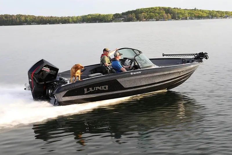 Slide: The Image of Manufacturer Provided Image: 2025 Lund 189 Pro-V GL boat cruising on a lake with two passengers and a dog. - 32