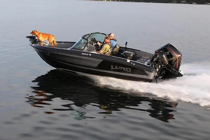 Slide: The Image of Manufacturer Provided Image: 2025 Lund 189 Pro-V GL boat cruising with passengers and a dog on a calm lake. - 33