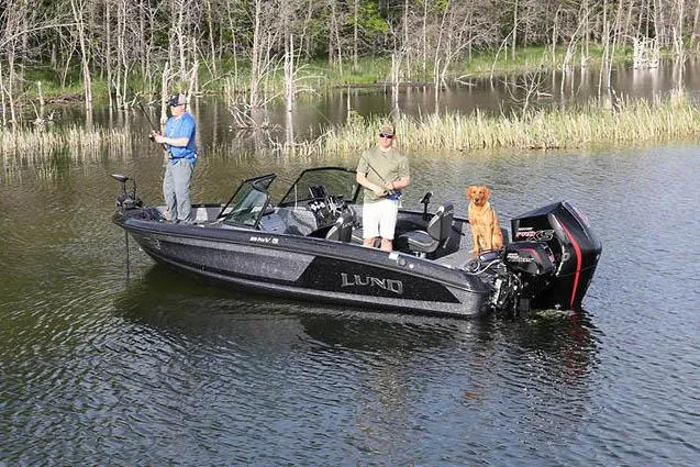 Slide: The Image of Manufacturer Provided Image: 2025 Lund 189 Pro-V GL boat with two people and a dog fishing on a lake. - 34