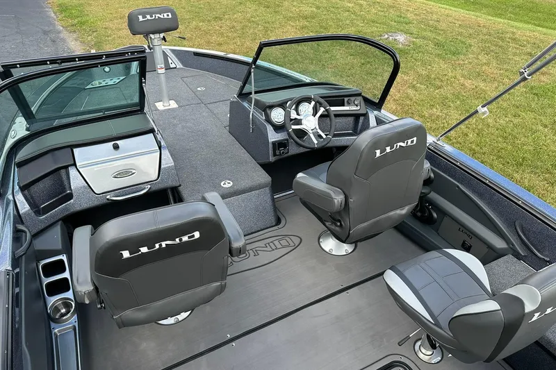 Slide: The Image of 2026 Lund 189 Pro-V GL boat interior with seating and steering console. - 6