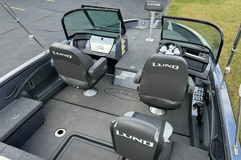 Slide: The Image of 2026 Lund 189 Pro-V GL boat interior with sleek seating and modern dashboard. - 7