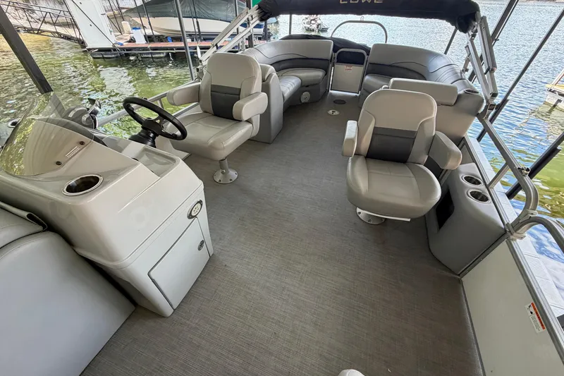 Slide: The Image of Spacious interior of 2021 Lowe SS 270 Extended WT pontoon boat with comfortable seating. - 10