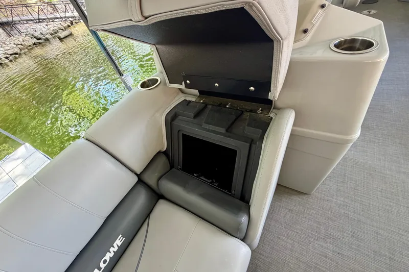 Slide: The Image of 2021 Lowe SS 270 Extended WT boat seat with storage compartment open. - 14