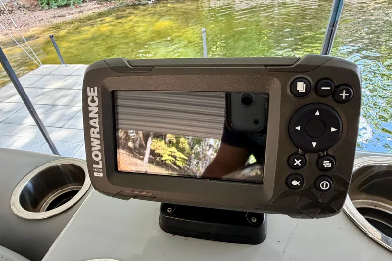 Slide: The Image of Fishfinder on 2021 Lowe SS 270 Extended WT boat, near water and dock. - 20