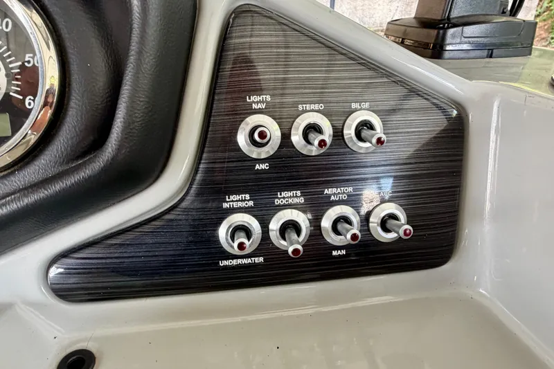 Slide: The Image of Control panel of 2021 Lowe SS 270 Extended WT boat with various switches. - 21