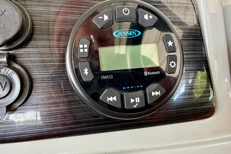 Slide: The Image of Jensen marine audio system on 2021 Lowe SS 270 Extended WT boat dashboard. - 23