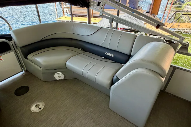 Slide: The Image of 2021 Lowe SS 270 Extended WT boat interior with gray seating and cup holders. - 25