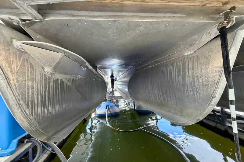 Slide: The Image of Underneath view of 2021 Lowe SS 270 Extended WT pontoon boat in water. - 30