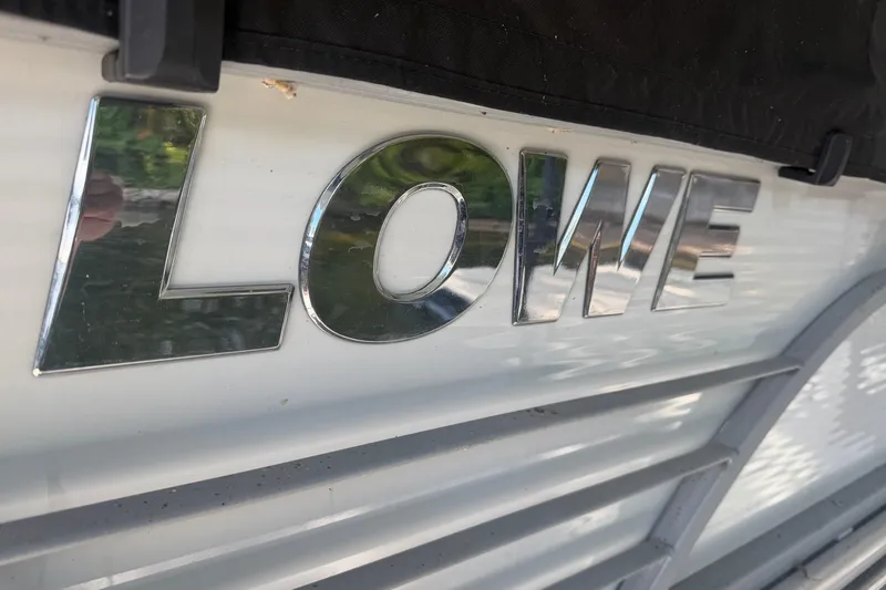 Slide: The Image of Chrome "LOWE" logo on 2021 Lowe SS 270 Extended WT boat. - 5