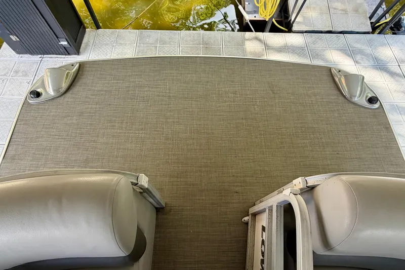 Slide: The Image of 2021 Lowe SS 270 Extended WT boat deck with seating and dock view. - 7