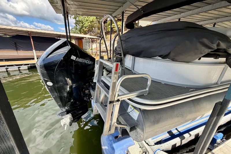 Slide: The Image of 2021 Lowe SS 270 Extended WT boat with Mercury outboard motor docked under cover. - 8