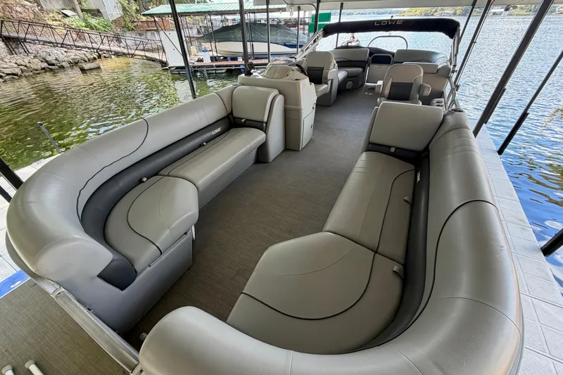 Slide: The Image of 2021 Lowe SS 270 Extended WT pontoon boat with spacious seating and modern design. - 9