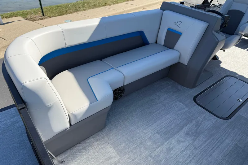 Slide: The Image of 2026 Qwest E-Class 22 Lanai boat interior with sleek, modern seating design. - 10