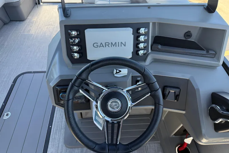 Slide: The Image of Steering console of 2026 Qwest E-Class 22 Lanai boat with Garmin navigation system. - 14