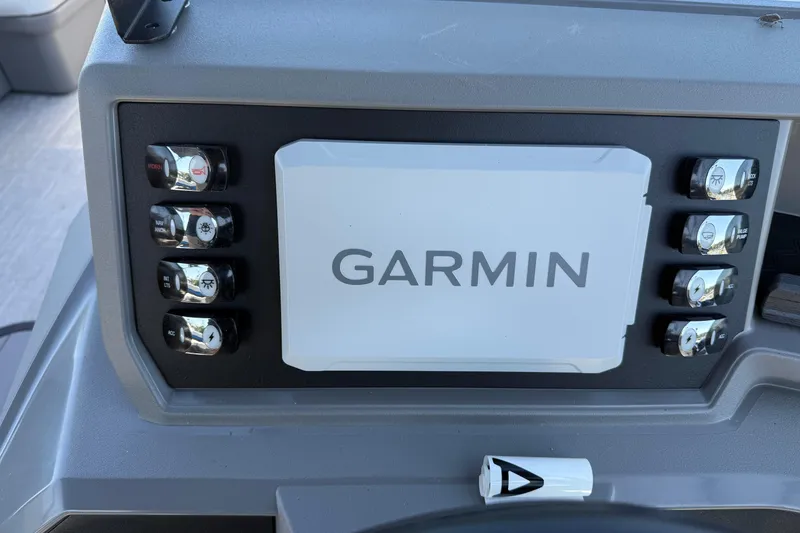 Slide: The Image of Control panel of 2026 Qwest E-Class 22 Lanai with Garmin display and switches. - 15