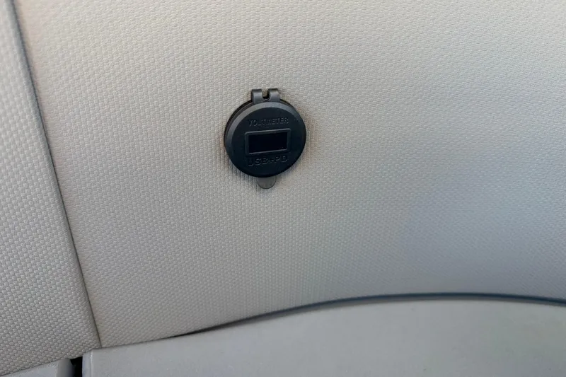 Slide: The Image of USB port on beige interior of 2026 Qwest E-Class 22 Lanai. - 19