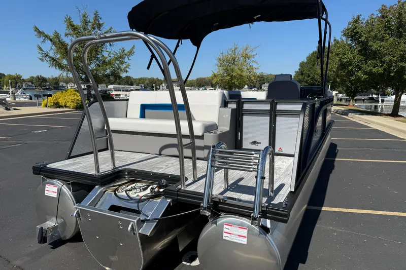 Slide: The Image of 2026 Qwest E-Class 22 Lanai pontoon boat with sleek design and spacious deck. - 6