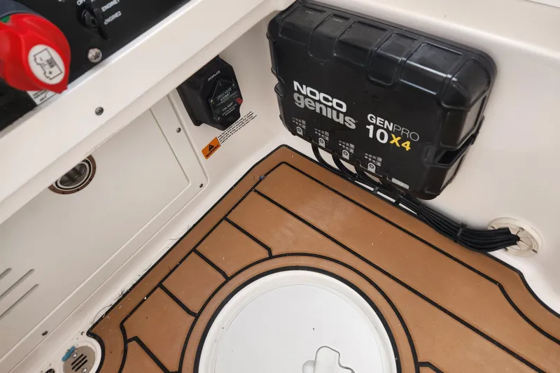 Slide: The Image of Interior of 2026 Caymas 291 boat featuring NOCO Genius GENPRO 10X4 charger. - 20
