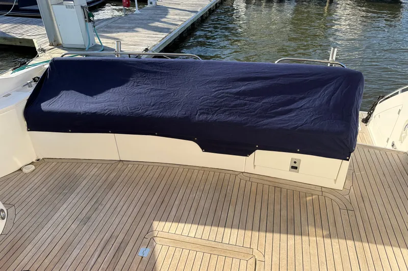 Slide: The Image of Covered seating area on 2008 Sunseeker Manhattan 50 yacht deck. - 21
