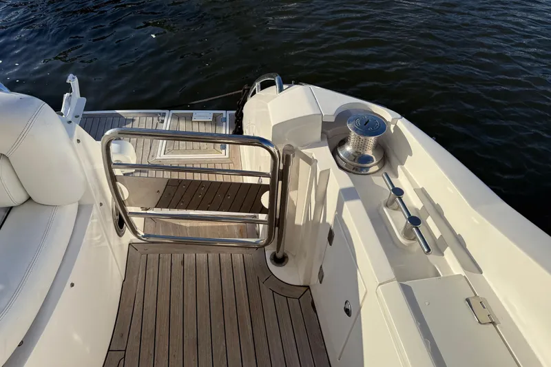 Slide: The Image of 2008 Sunseeker Manhattan 50 yacht deck with railing and water view. - 23