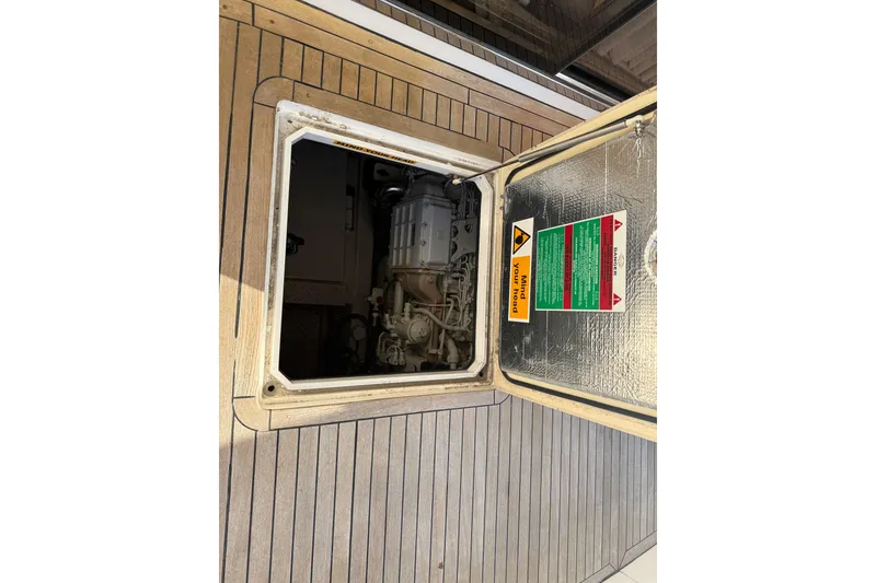 Slide: The Image of Engine compartment of 2008 Sunseeker Manhattan 50 yacht with open hatch. - 24