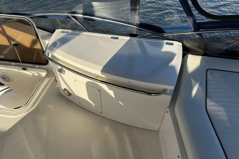 Slide: The Image of 2008 Sunseeker Manhattan 50 yacht interior with seating and storage, overlooking water. - 28