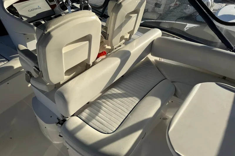 Slide: The Image of Interior of 2008 Sunseeker Manhattan 50 yacht with white seating and Garmin navigation. - 30