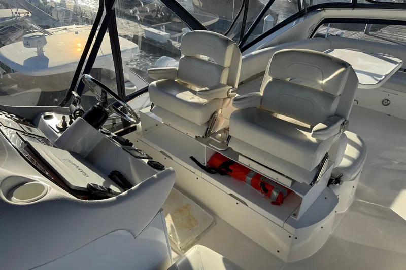 Slide: The Image of Interior of 2008 Sunseeker Manhattan 50 yacht with helm and white seating. - 34