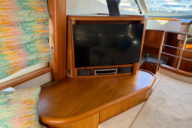 Slide: The Image of Luxurious interior of 2008 Sunseeker Manhattan 50 yacht with TV and wooden furnishings. - 44