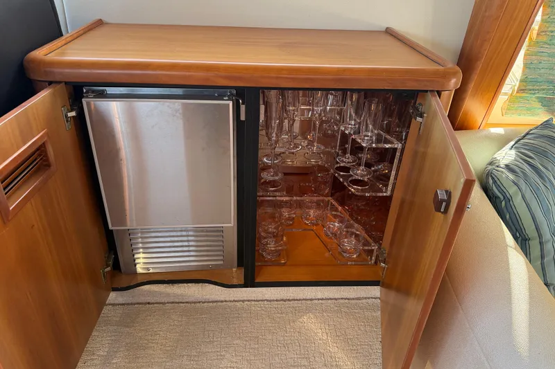 Slide: The Image of Luxury yacht interior with glassware cabinet and mini fridge, Sunseeker Manhattan 50, 2008 model. - 46