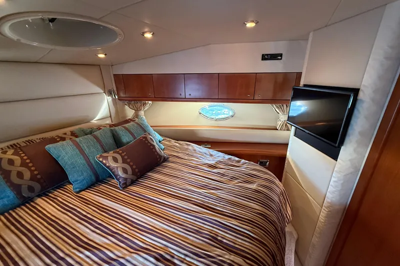 Slide: The Image of Luxurious cabin interior of 2008 Sunseeker Manhattan 50 yacht with cozy bedding and TV. - 60