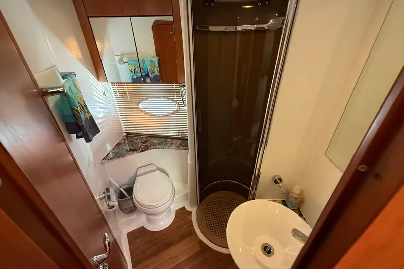 Slide: The Image of Luxurious bathroom in 2008 Sunseeker Manhattan 50 yacht with modern fixtures and wood accents. - 63