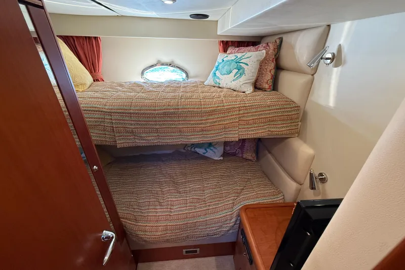 Slide: The Image of Cozy bunk beds in 2008 Sunseeker Manhattan 50 yacht cabin with nautical decor. - 65