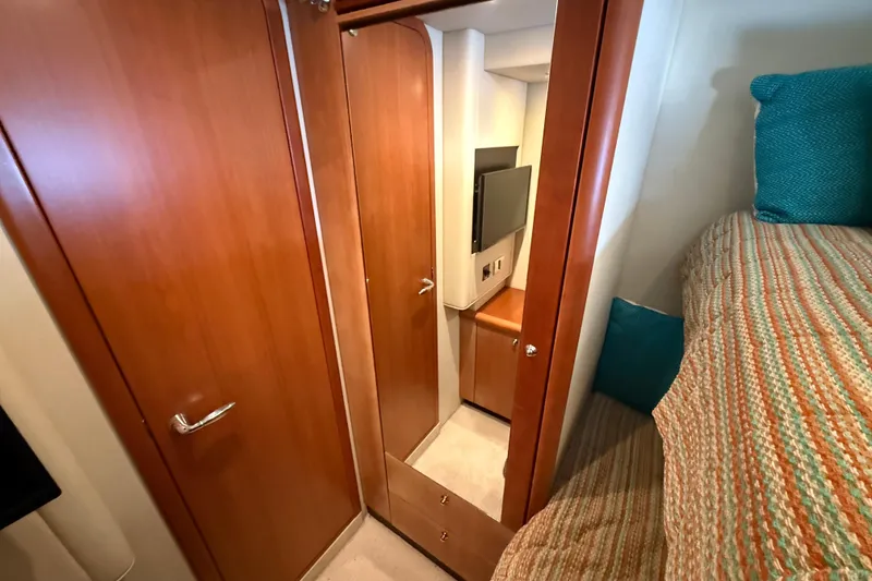 Slide: The Image of Interior of 2008 Sunseeker Manhattan 50 yacht with wood paneling and cozy bedding. - 67