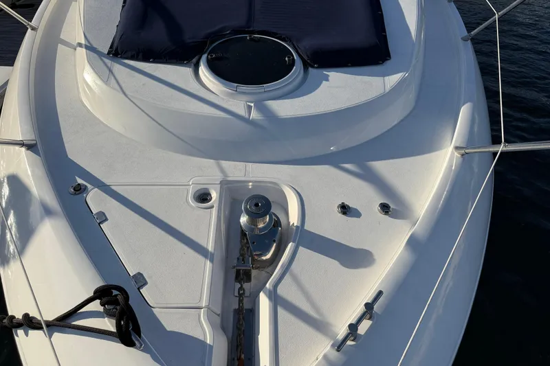Slide: The Image of 2008 Sunseeker Manhattan 50 yacht deck with anchor and hatch, moored on water. - 7