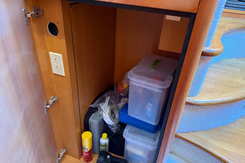 Slide: The Image of Storage cabinet on 2008 Sunseeker Manhattan 50 yacht with organized containers and cleaning supplies. - 70