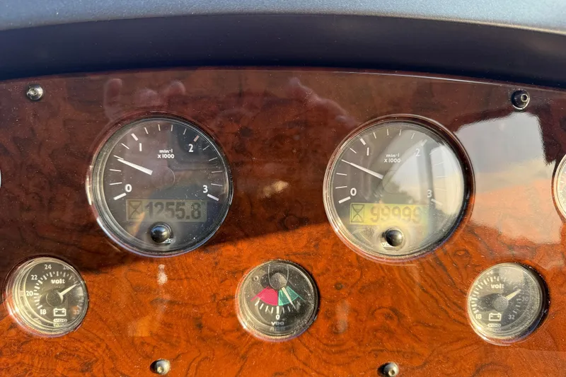 Slide: The Image of Dashboard of 2008 Sunseeker Manhattan 50 yacht with gauges and wood finish. - 80